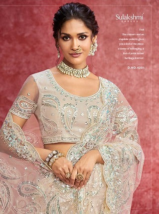 Sulakshmi Ambika Neet Off White Color 4201 Carnival Wear Saree